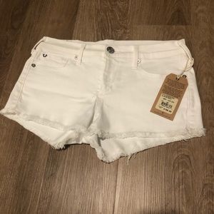 White True Religion “Joey cut off” denim shorts